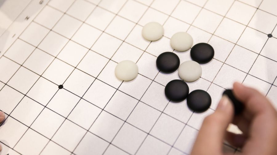 Photo of person playing weiqi